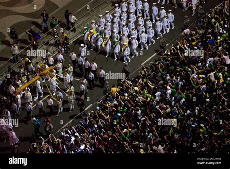 A Group Carries A Cross On Their Way To The Stage Left During The