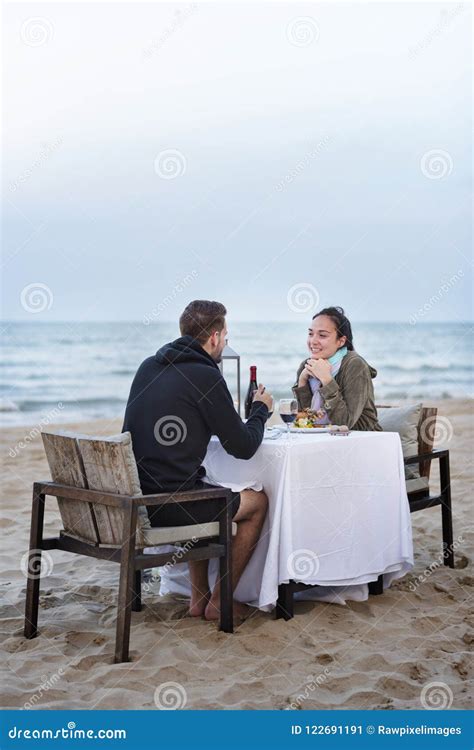 Couple Enjoying a Romantic Dinner at the Beach Stock Image - Image of ...