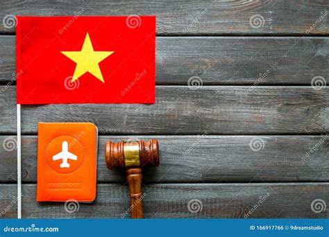 Visa To Vietnam Concept Vietnamese Flag Near Passport And Judge Hammer On Dark Wooden