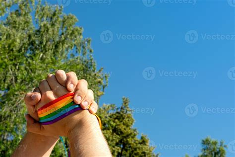 Hand Making Sign Of Friendship And Equality With Gay Pride Lgbt Rainbow Flag Wristband 13681237