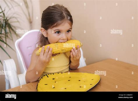 Adorable Little Girl Eating Corn At Home Cute Kid Tree Year Old Eat