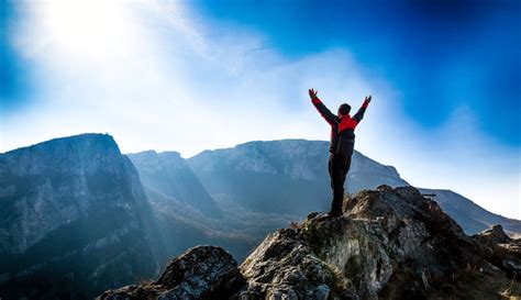 Man On Top Of A Mountain