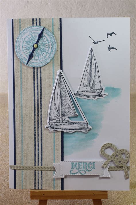 A Close Up Of A Card With A Sailboat On It