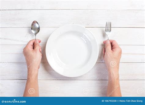 Human Hand Holding A Fork And Spoon Stock Photo Image Of People