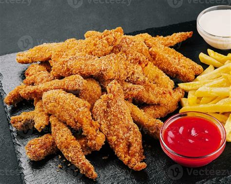 Fried chicken, nuggets and french fries 34753872 Stock Photo at Vecteezy