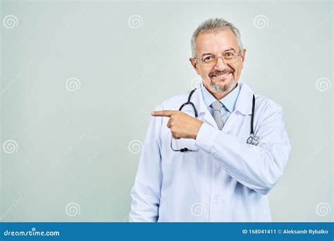 Cheerful Mature Doctor Posing And Smiling At Camera Healthcare And Medicine Isolate On Blue