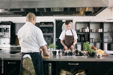 Two Men Cooking In Modern Kitchen Stock Photo Adobe Stock