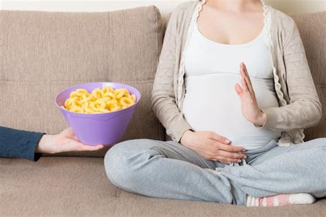 Premium Photo Pregnant Woman Sitting On The Sofa Refuses To Eat