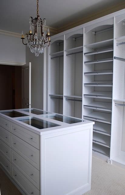 Master Dressing Room With Island Shoe Fences And Rosettes Traditional