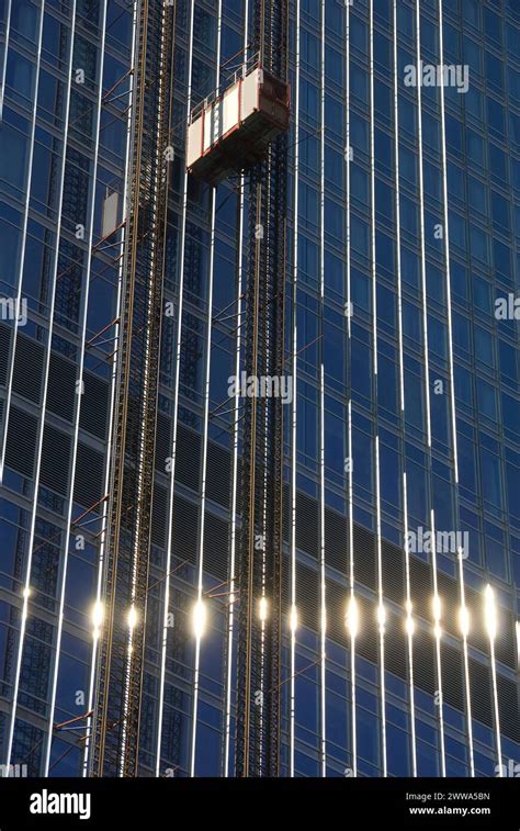 Elevators On Side Of Glass Tower During Construction Of Trump Tower