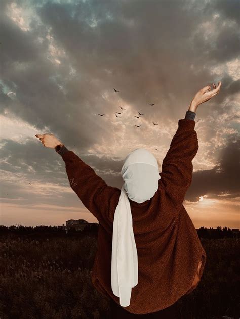 A Woman In A Brown Jacket And White Scarf Flying Through The Air With