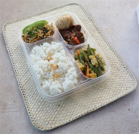 Premium Photo Indonesian Typical Lunch Box Filled With Rice