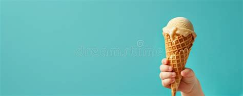 Baby Kid Hand Holding Big Ice Cream In Waffles Cone On Blue Background