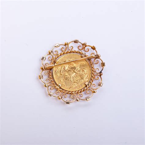 Prendedor Oro 18 K Y Libra Zorrilla