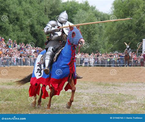 Knight In Heavy Armor On A Horse And With A Lance Royalty Free Stock