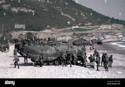 U S Marines Aboard Tracked Landing Vehicle LVTP 7 Land During