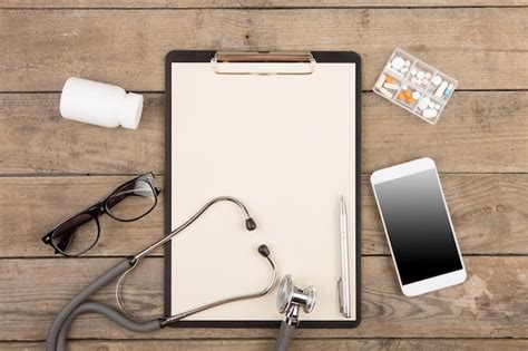 Premium Photo Workplace Of A Doctor Stethoscope Clipboard Pills