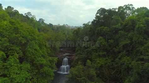 Journeying To A Breathtaking Tropical Waterfall Stock Footage Video