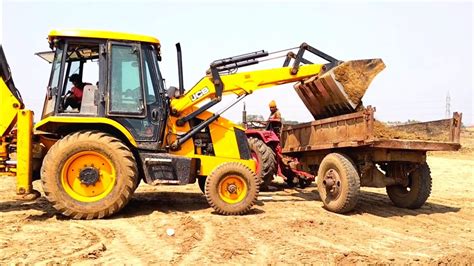 New Jcb Dx Machine Loading Red Mud In Old John Deere And Mahindra