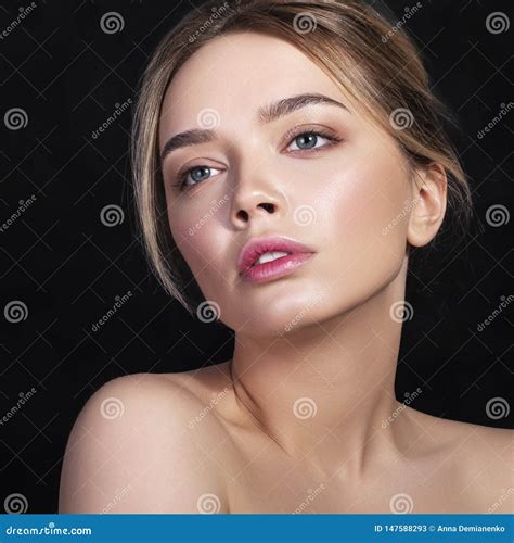 Cute Caucasian Woman With Daily Hairstyle On A Dark Background She Wears Nude Make Up Stock