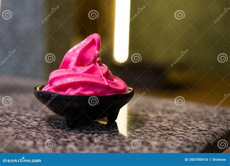 A Delicious Pink Soft Serve Ice Cream In Black Bowl Stock Photo Image