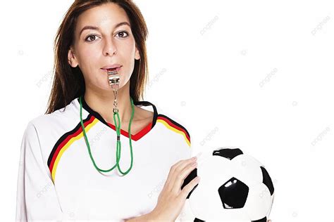 Stunning Female Football Fan Blowing Whistle And Clutching A Soccer