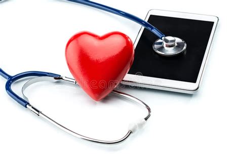 Stethoscope In The Shape Heart And Of A Heart Beat On A EKG Stock Photo