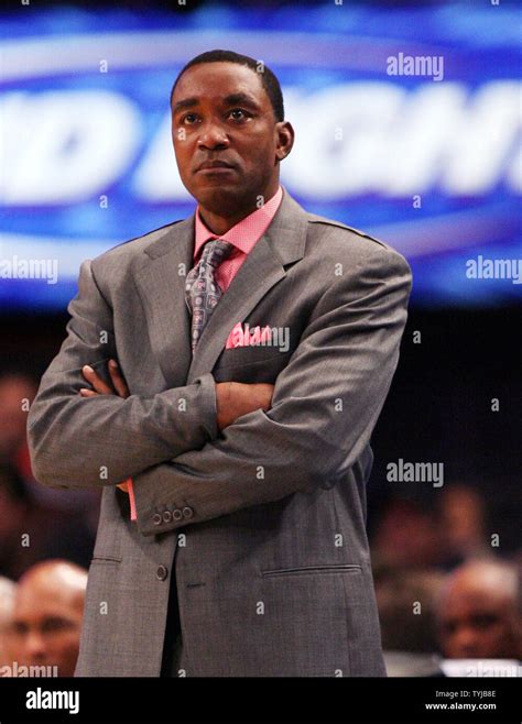 New York Knicks Head Coach Isiah Thomas Folds His Arms While Watching