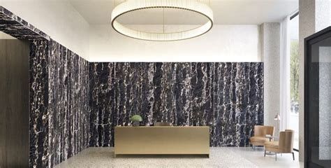 An Office Lobby With Marble Walls And Flooring