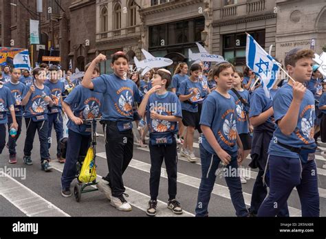 New York New York June 04 Participants Holding Israeli Flags And Signs March Up Fifth Avenue