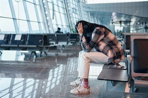 Premium Photo | Sad young girl crying when sitting in the modern airport