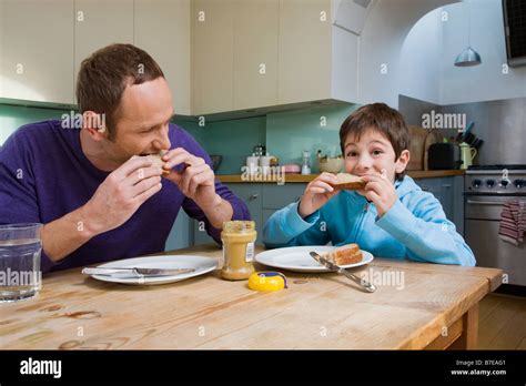 Child eating peanut butter sandwich hi-res stock photography and images ...