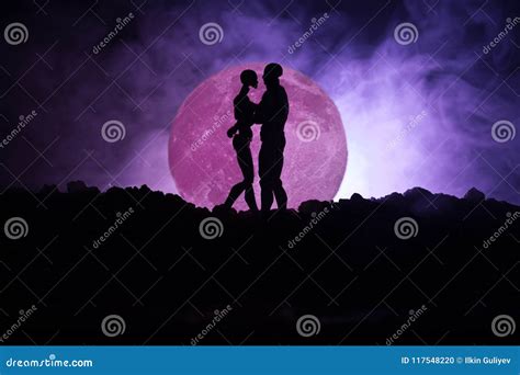 Silhouette Of Couple Kissing Under Full Moon Guy Kiss Girl Hand On