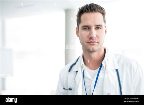 Portrait Of Mature Male Doctor Looking At Camera Stock Photo Alamy