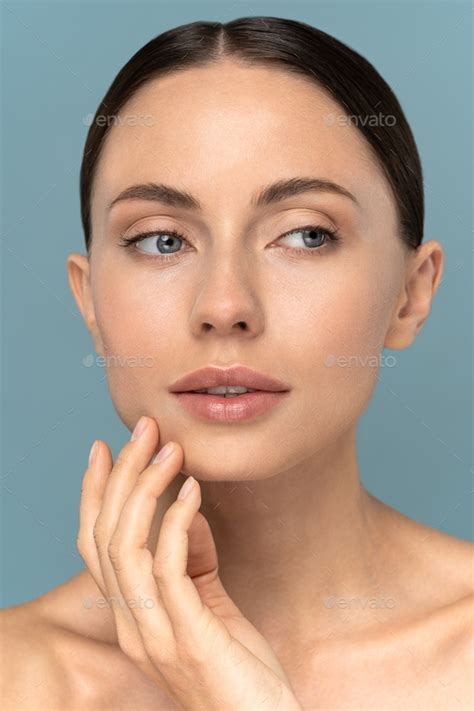 Young Girl With Natural Makeup Combed Hair Touching Well Groomed Pure