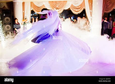 Amazing First Wedding Dance Of Newlyweds On Low Pink Light And Heavy