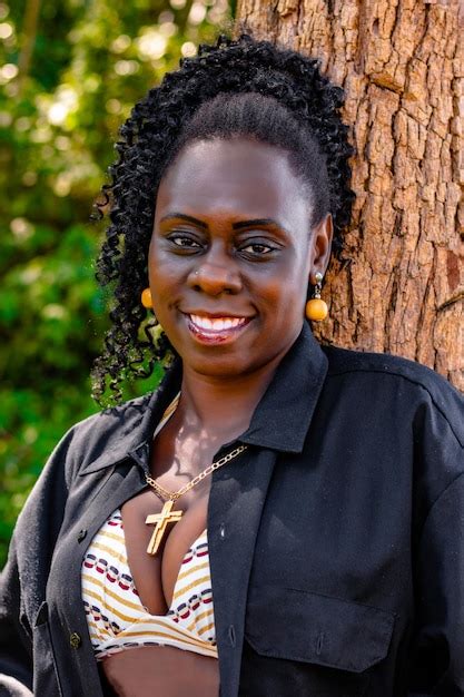 Premium Photo Portrait Of Smiling Mid Adult Woman Standing Against