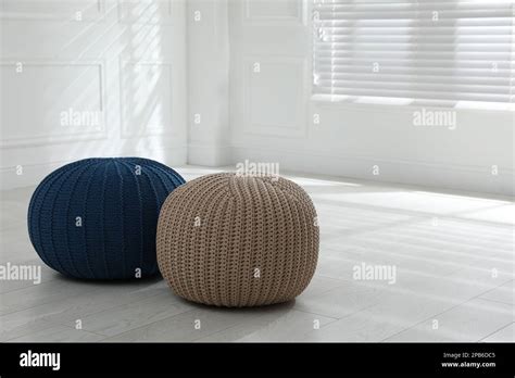 Different Stylish Poufs In Room Space For Text Stock Photo Alamy