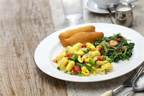 Jamaican Breakfast Ackee And Saltfish With Fried Dumplings And Callaloo