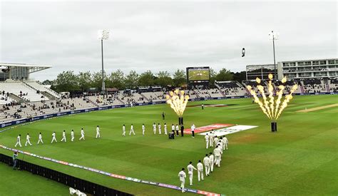 Fireworks go off as India and New Zealand's players make their way onto ...