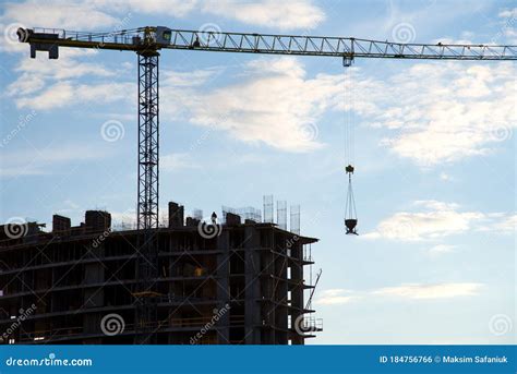 Preparing To Pour A Bucket Of Concrete Into Formworktower Crane