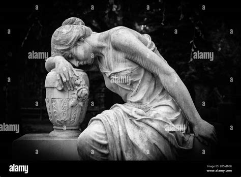 Sad and weeping woman sculpture. Sad grieving expression sculpture with ...