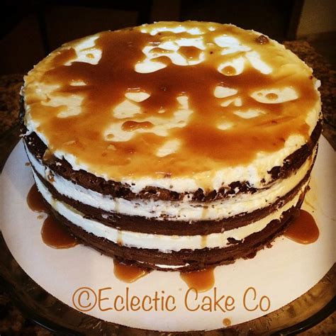 There Is A Cake On The Plate With Caramel Sauce And Ice Cream Toppings