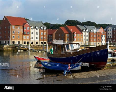 Man Fishing In The River Esk Whitby North Yorkshire England Uk Stock