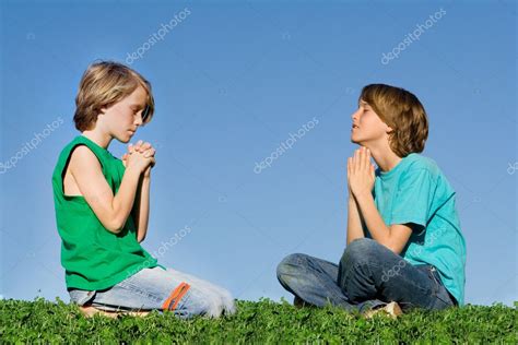 Christian children praying outdoors at prayer group or bible camp Stock Photo by ©mandygodbehear ...