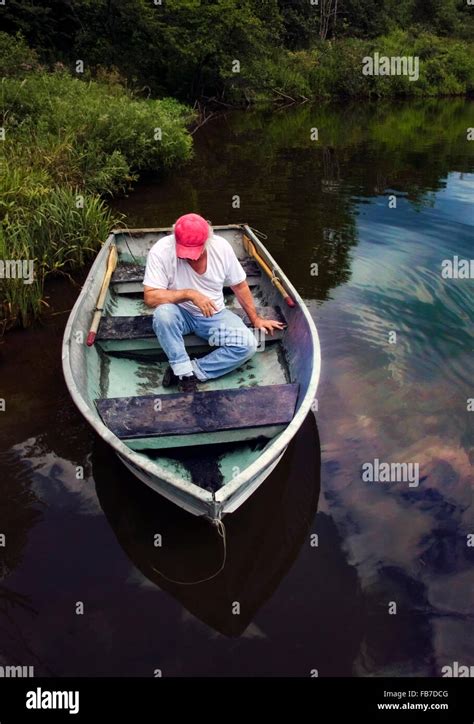 Man In A Rowboat Hi Res Stock Photography And Images Alamy