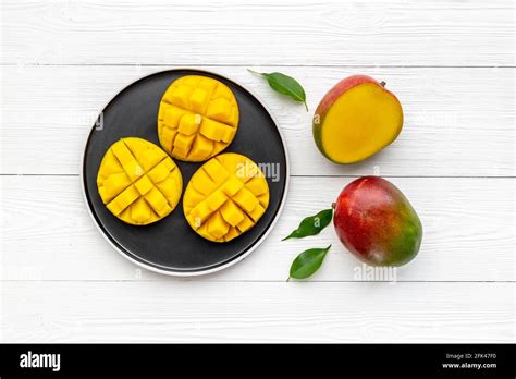 Plate Of Mango Fruits And Mango Cubes Tropical Breakfast Top View