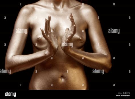 Close Up Of Nude Woman Covered In Gold With Hands In Position Stock Photo Alamy