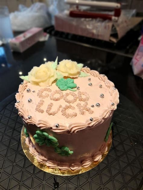 There Is A Cake That Has Been Decorated With Flowers