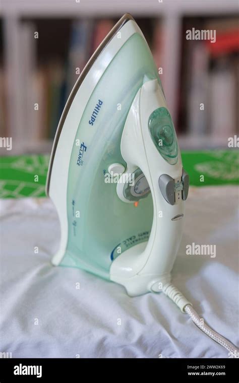 Iron On An Ironing Board Stock Photo Alamy